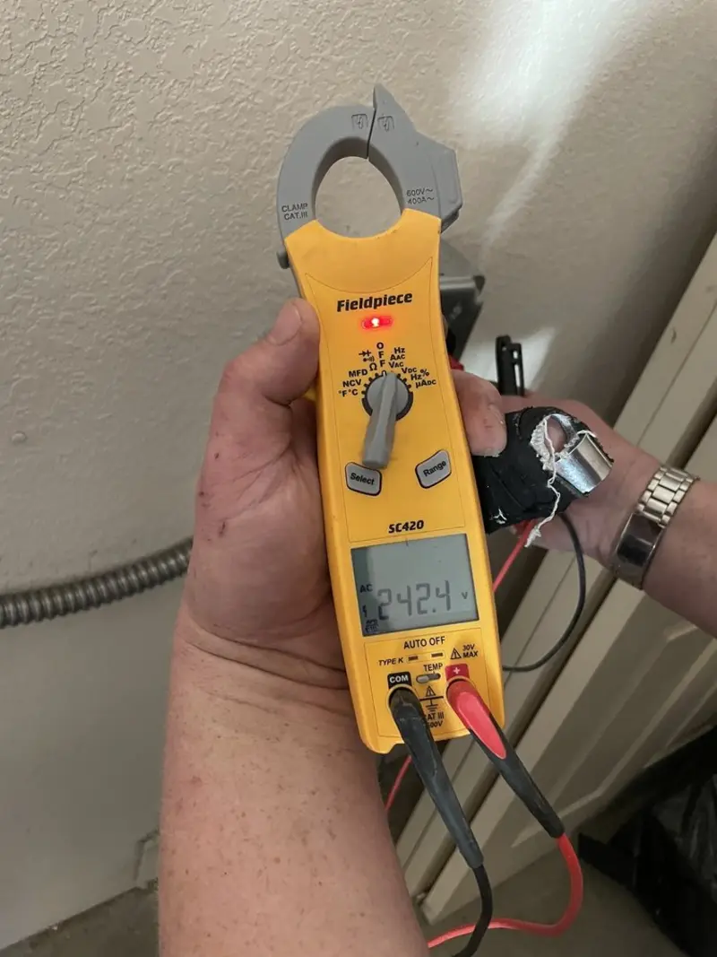 Voltage testing with clamp meter during Ceiling Fan Installation in Upper Chichester